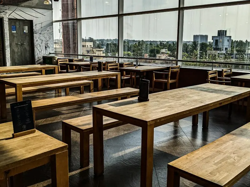 Our dining room with wooden tables and large windows